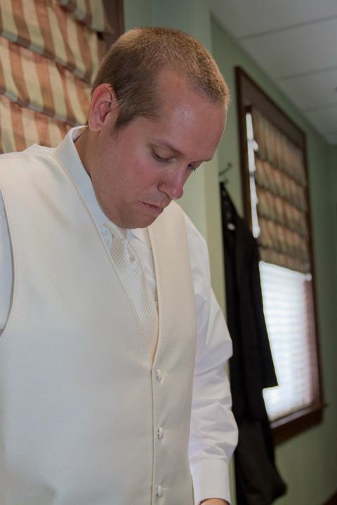 Mr Spin getting ready he chose an ivory vest and black tuxedo with white 