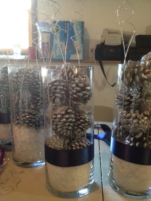 We will also have 5 votive candles around it the pine cones are painted 