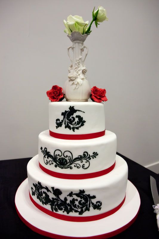 Here is our wedding cake The vase on the top is a family heirloom that has 