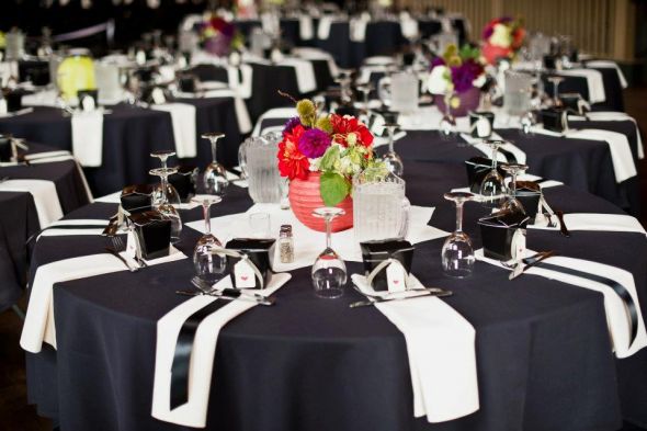 A full table view wedding black green purple red ivory flowers