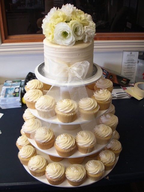 We are having a cupcake tower with a cake on top for our wedding cake