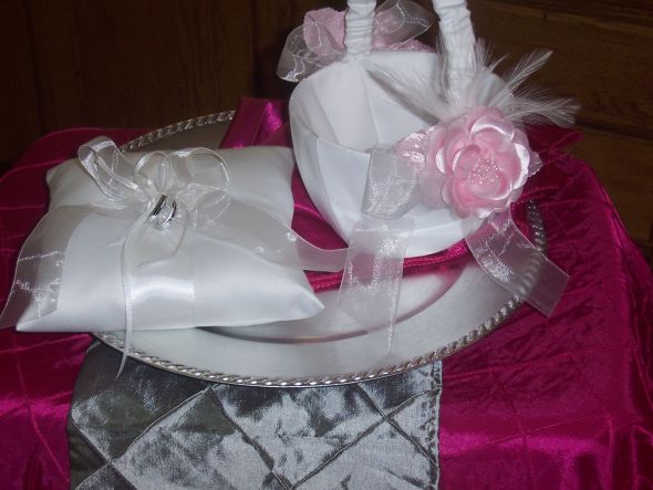 I have one white ring bearer pillow and a flower basket with light pink 