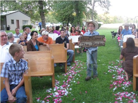 A Rustic Outdoor Wedding!  Look at the church we built in out front yard! (pics) :  wedding rustic outdoor arch hay bales country simple 305457 2427501688283 1273777045 32959678 1688955383 N