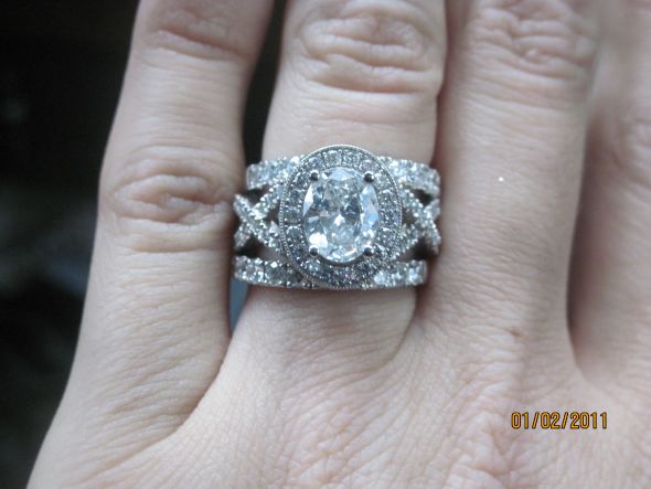 Here is mine oval 2 carat with the wedding bands made to sit flush