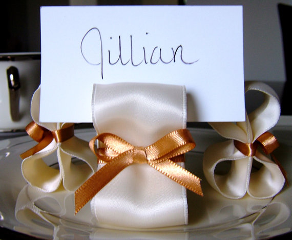 I handmake table number holders and place card holders Below is an example