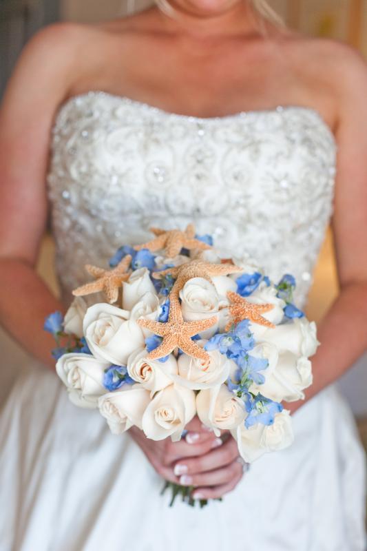 Ivory roses blue flowers and real starfish What color is your bridal 