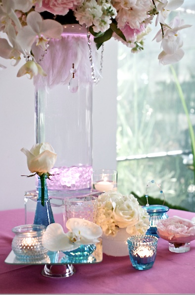 Centerpieces with peonies blue hydrangea and green orchids