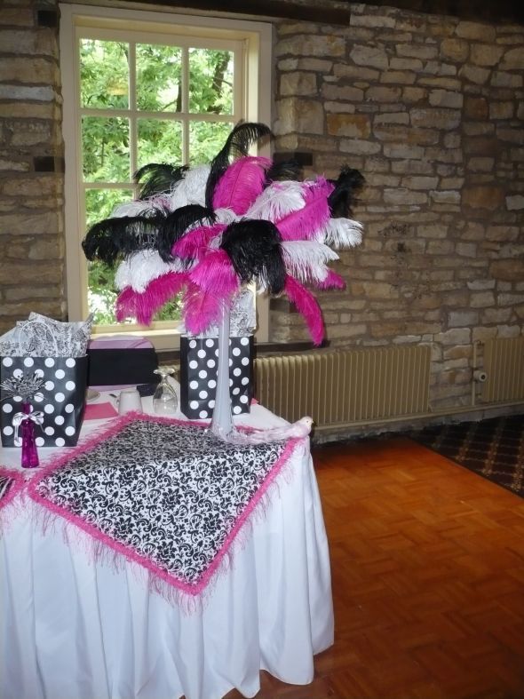 Black wedding centerpieces ostrich feathers fuchsia tower vases
