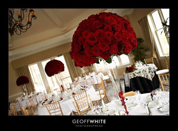 Tall red rose arrangements for ceremony centerpieces something like this