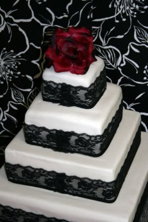 red and black wedding cakes with flowers