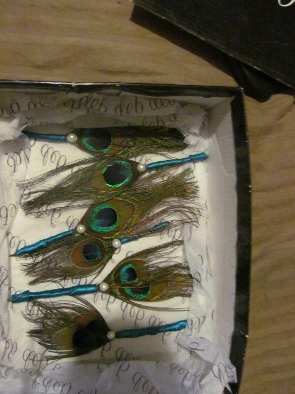peacock feather boutonnieres
