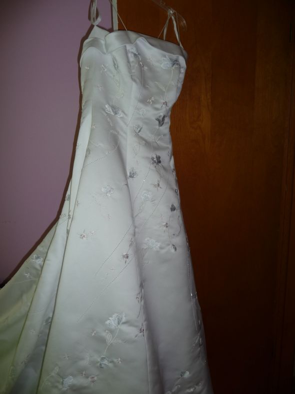 My dress is white but has pink and blue embroidered flowers on it