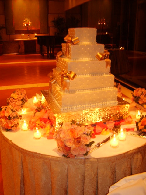 His groom's cake will have an LSU theme two tiers gold with purple tiger