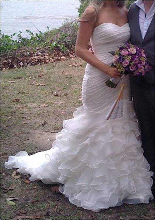 Looking for this dress or similar :  wedding finished mermaid ruffles trumpet fishtail edges Whos Dress Is This
