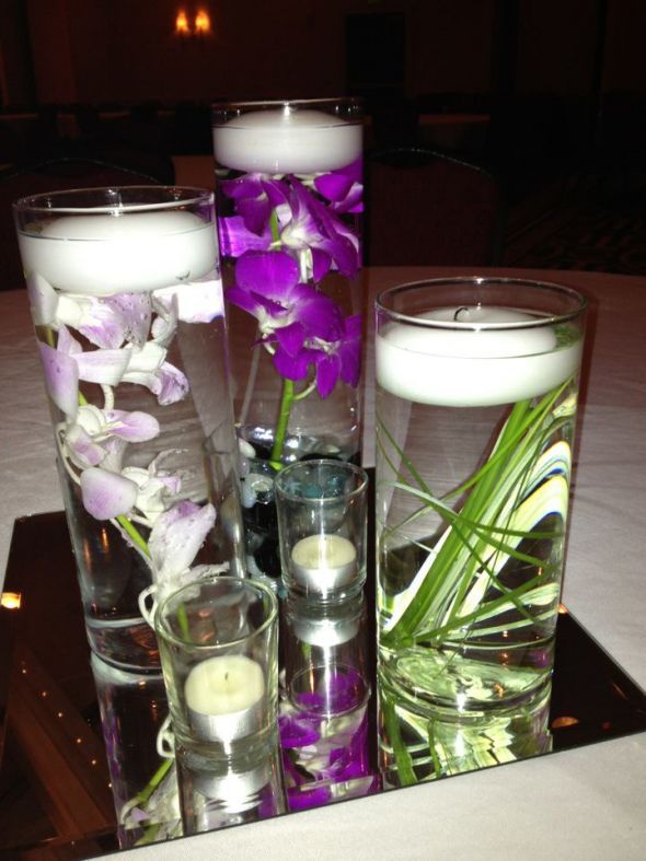 my purple orchids center piece with bear grass loved it wedding purple 