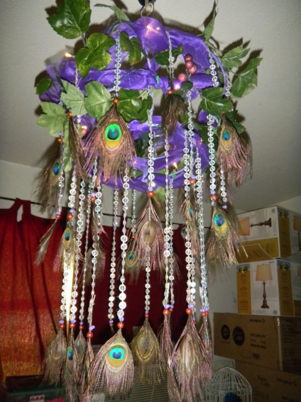 feather centerpiece and chandelier wedding