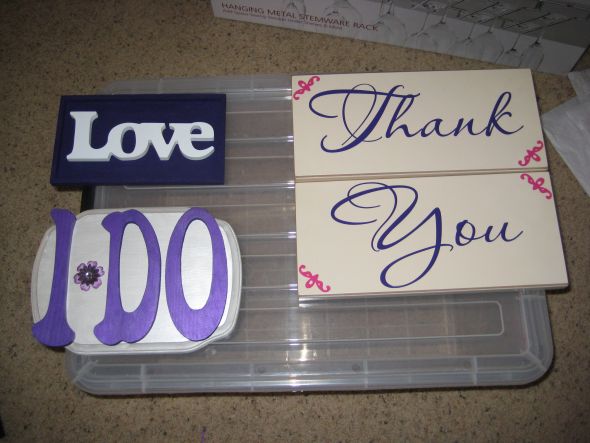 Items from purple magenta and orange wedding wedding table numbers sign