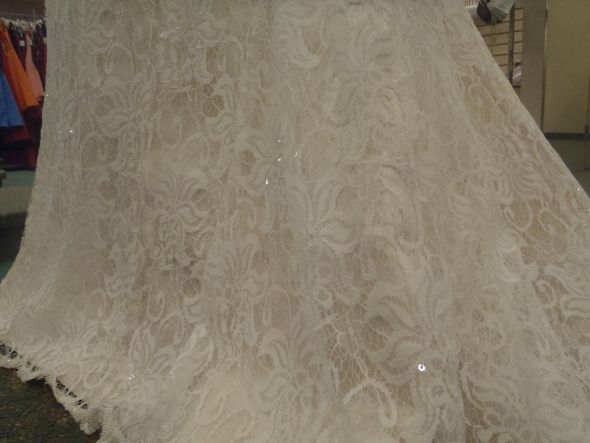 It has full lace and a little beading and is a mild trumpet fit and 