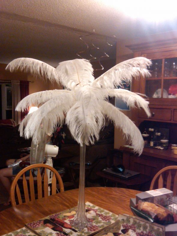 centerpieces with feathers for wedding tables