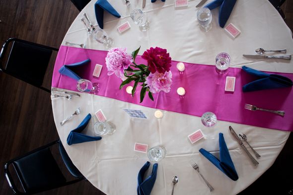 Our colors were navy and fuschia We kept the table decor simple because our 