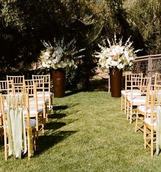 Outdoor ceremony: show me your focal point! :  wedding Chair Ribbons And Big Altar Arrangement