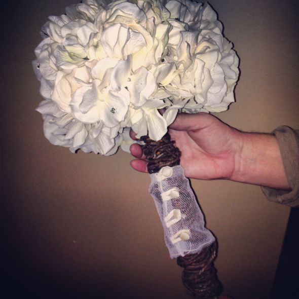 Ivory bouquet with part of grandmothers dress as wrap