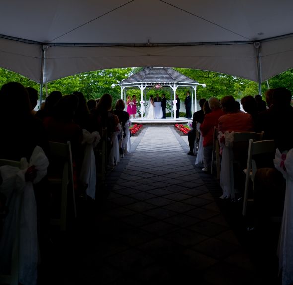 Lowndes Grove Wedding reception tent party photo with groom The couch under
