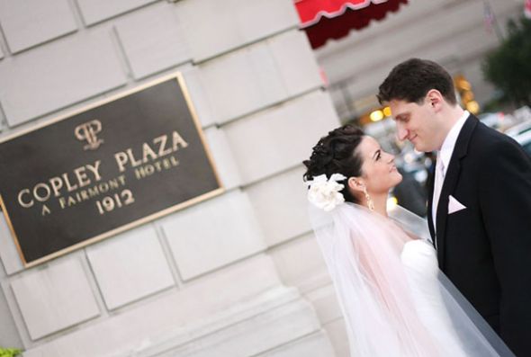 What are you wearing in your hair? : wedding hair flower clip accessory Bride Groom Outside Hotel