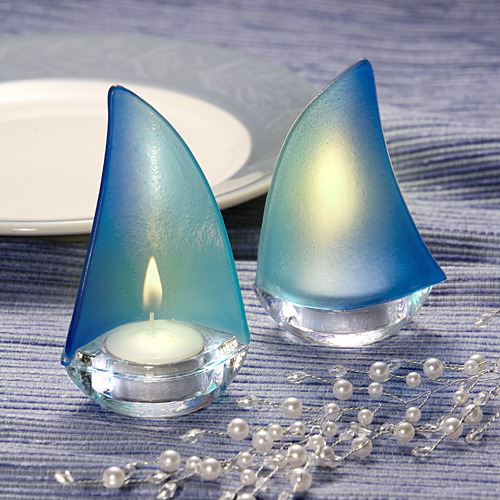 I have many beach theme wedding favors including these blue sailboat candle