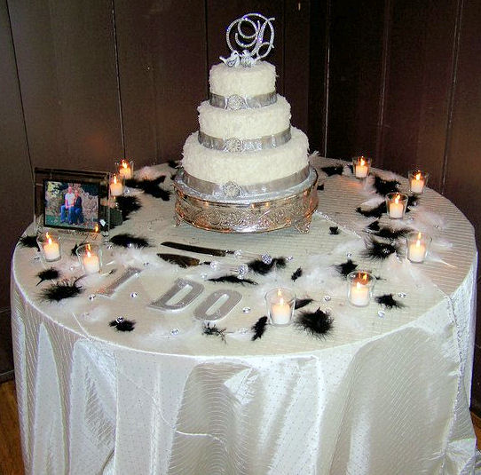Feathers on cake table are also available for purchase Bling 