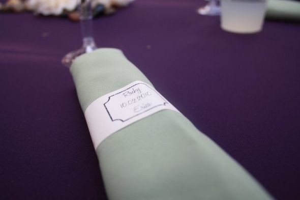 Purple green tablecloths napkins lantern centerpieces wedding 