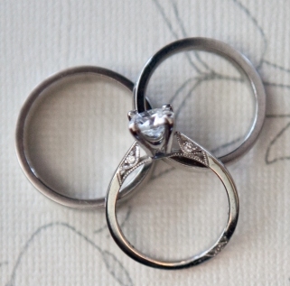 Moissanite, Lab-Created, Simulated?! :  wedding diamonds moissanite sapphire topaz engagement ring stone gem Ring  His Mine And Ering On Cream Background