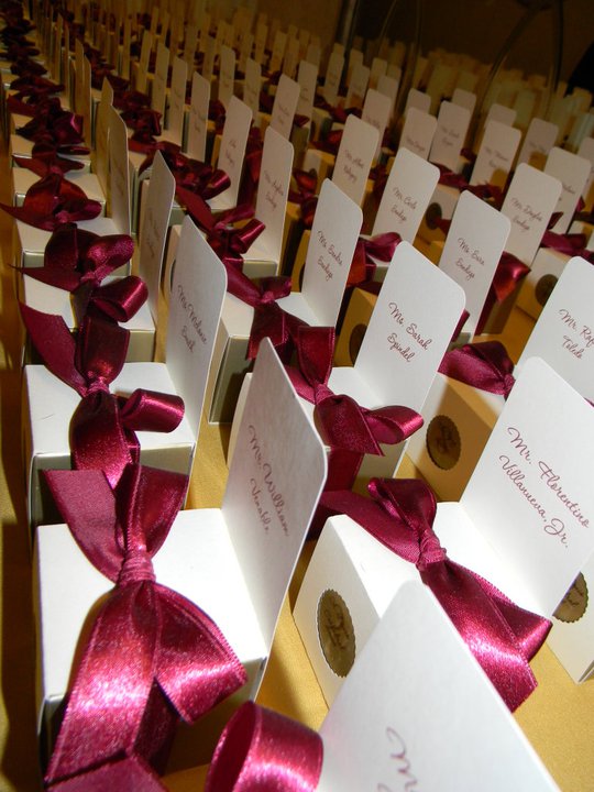 The table numbers were printed on clear labels and placed on the favor boxes 