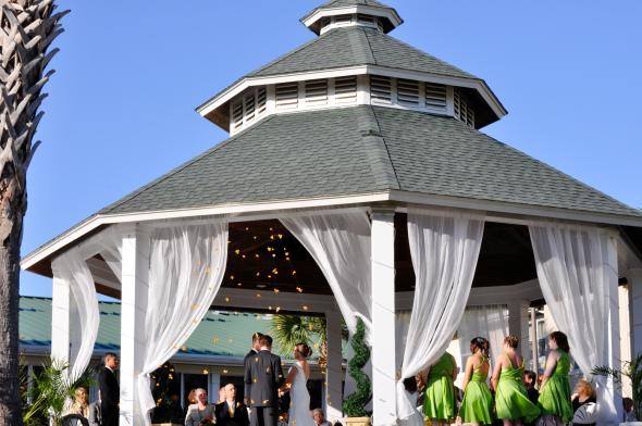 Our Ceremony wedding outdoor gazebo hanging flowers orchids florida tulle