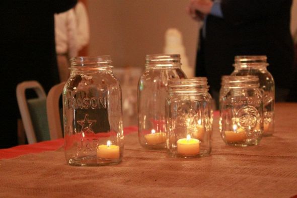 Mason jars and homemade candles wedding Centerpieces1