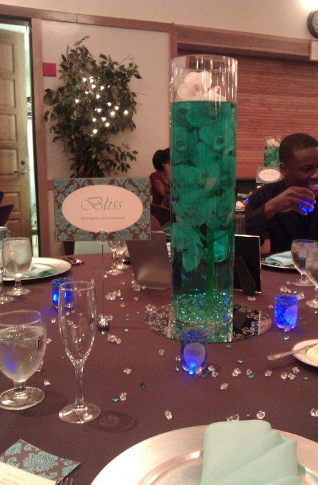 The votives were filled with light blue water beads and 1 blue submersible 