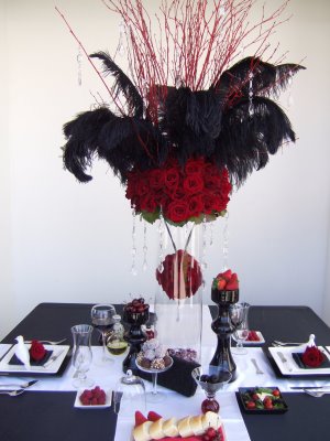 i am looking for 12 eiffel tower vases with red roses and black feathers