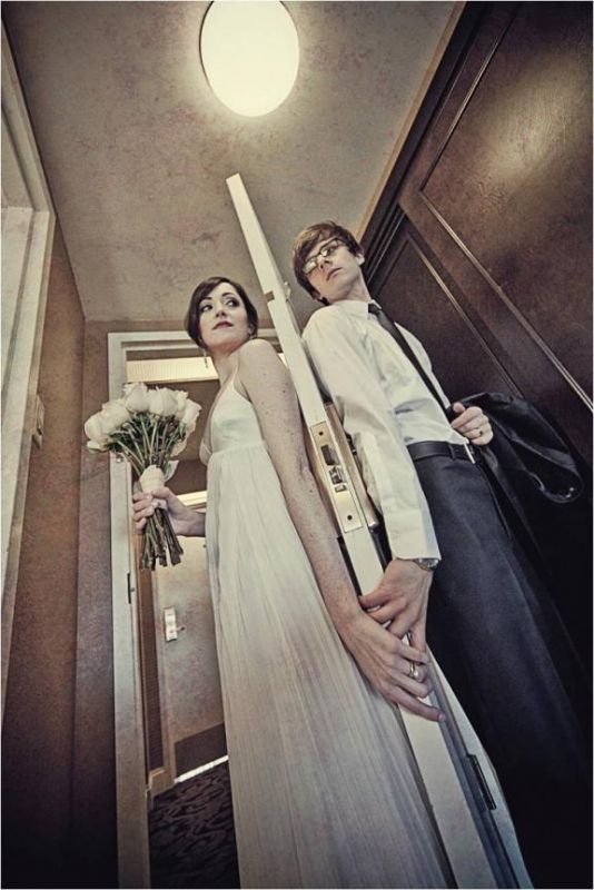 Did you REGRET your first look AT ALL :  wedding Bride With Flowing Ivory Wedding Dress V Neck Spaghetti Straps Stand On One Side Of Door Groom In Tux On Other Side First Look