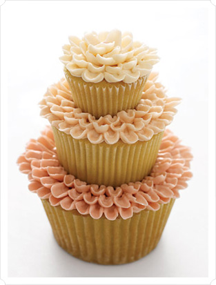 I don't care if people think these are cheesy, I so want cupcake centerpieces :) :  wedding Martha Stewart Cupcakes 3